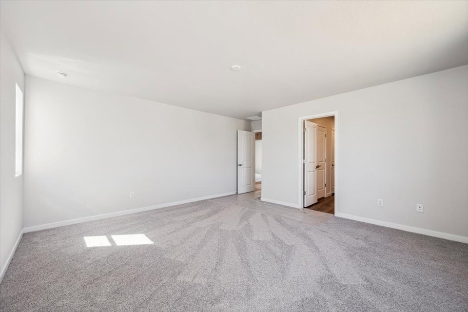 A hallway with white walls.