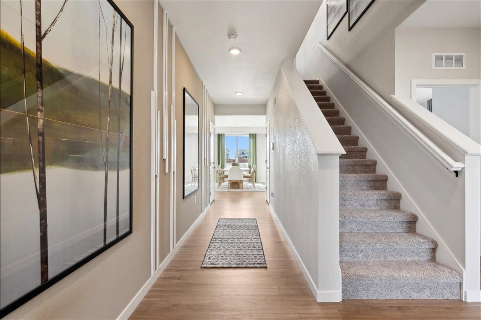 A long hallway with a glass door.