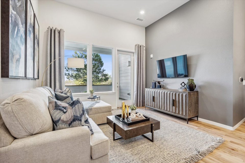 A living room with a large window.