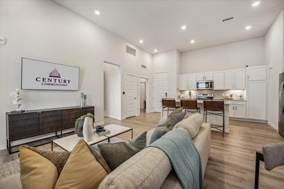 A living room with a couch and a table.