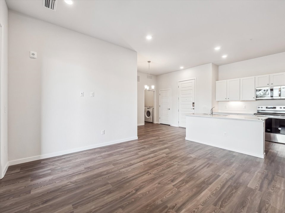 A large kitchen with white cabinets.