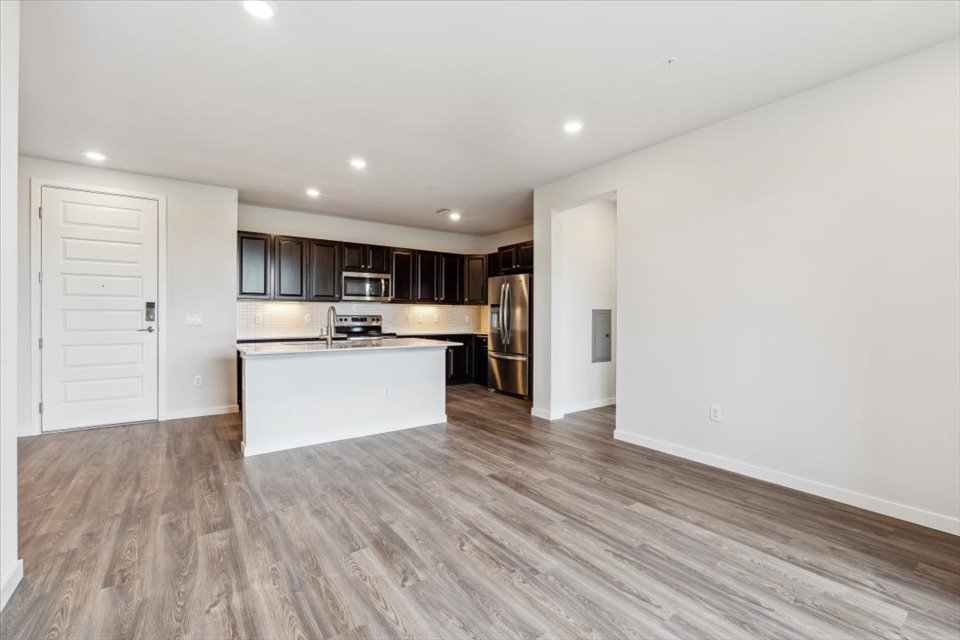 A kitchen with wooden floors.