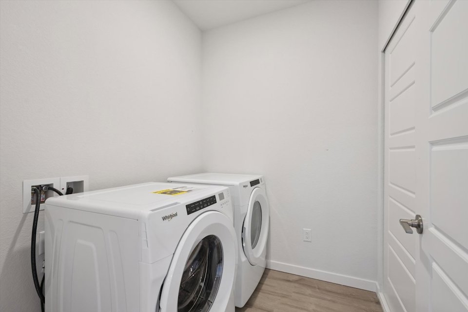 A white washing machine in a room.
