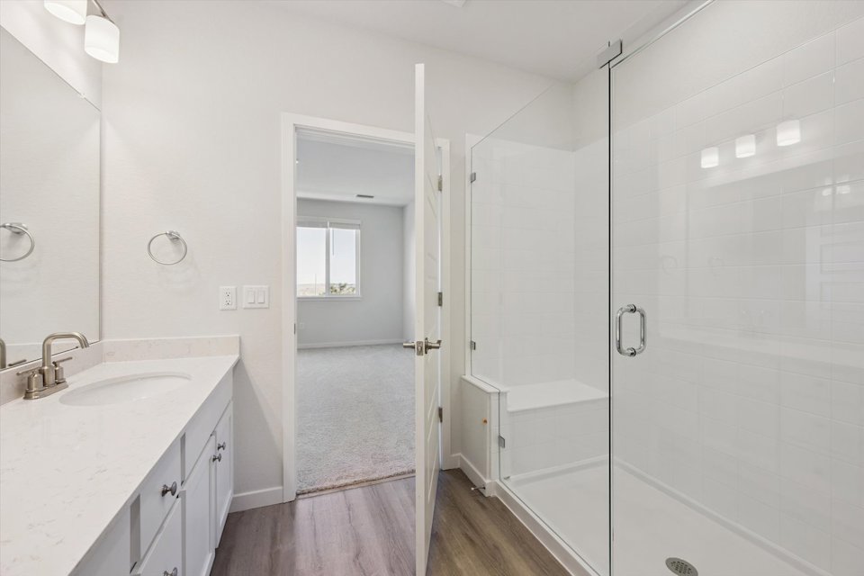 A bathroom with a glass shower.