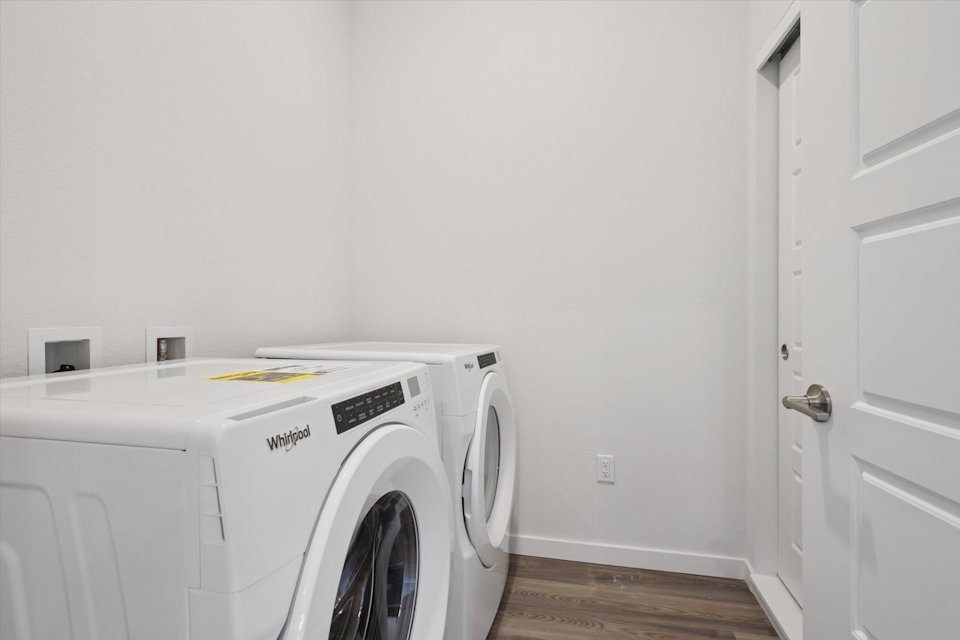 A white washing machine in a room.