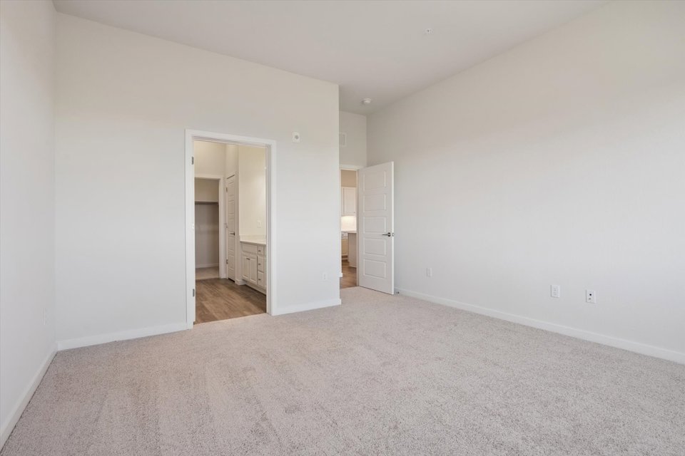 A hallway with white walls.