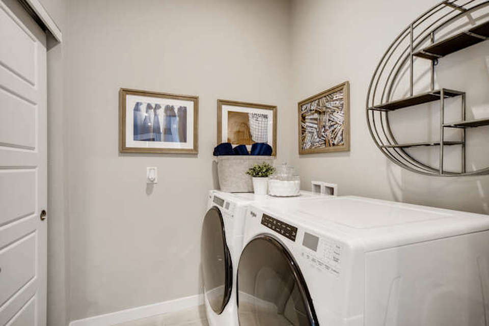 A white washer and dryer in a room.