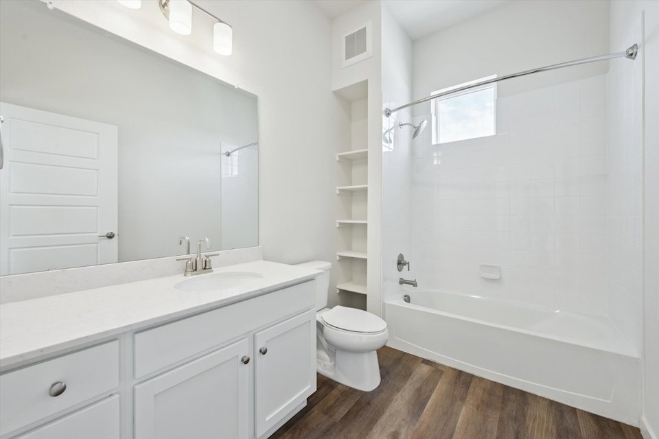A bathroom with a standup shower.