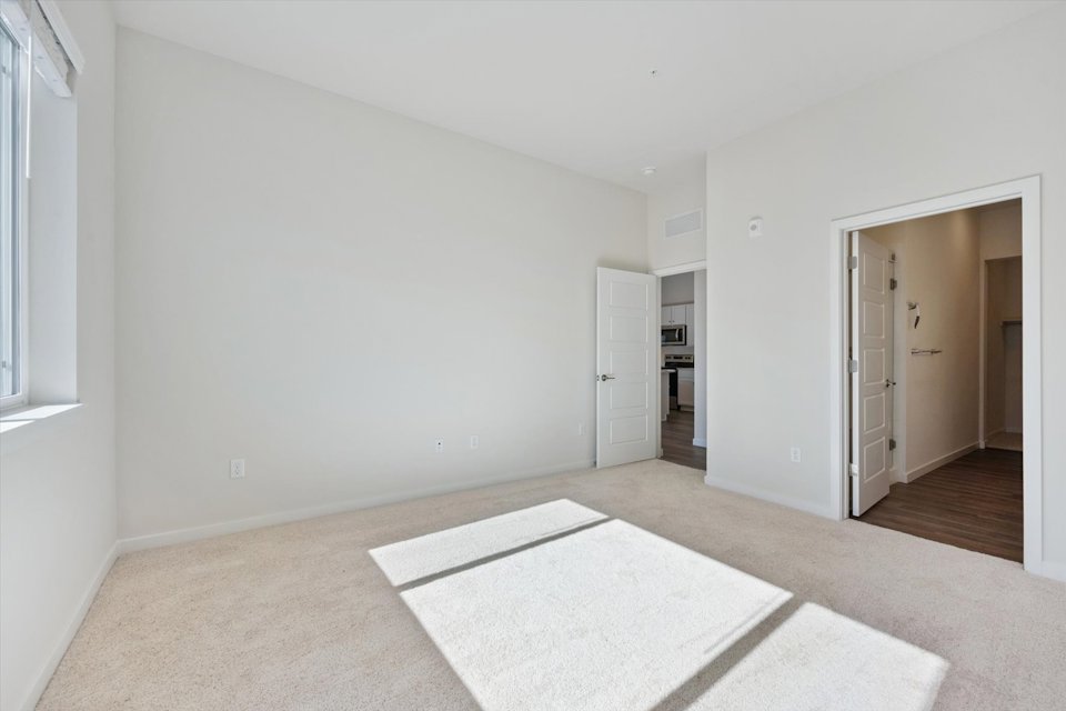 A room with a rug and a rug.