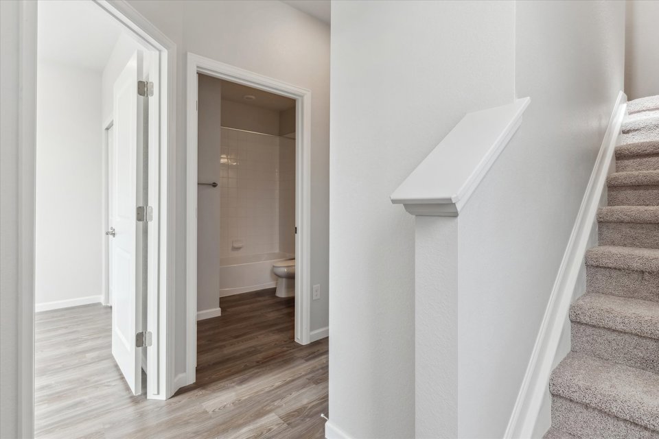 A staircase leading to a bathroom.