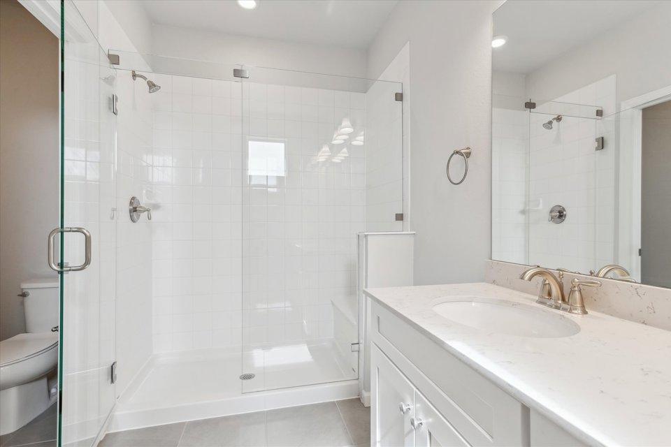 A bathroom with a glass shower.
