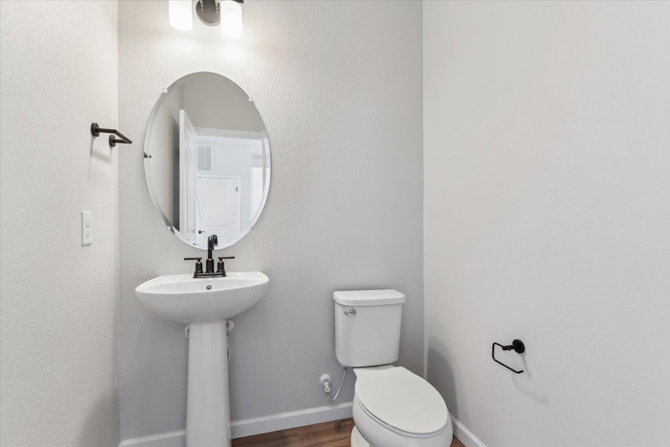 A bathroom with a sink and toilet.