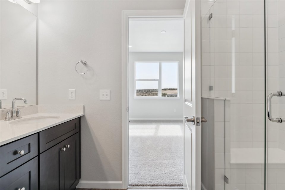 A bathroom with a glass shower.