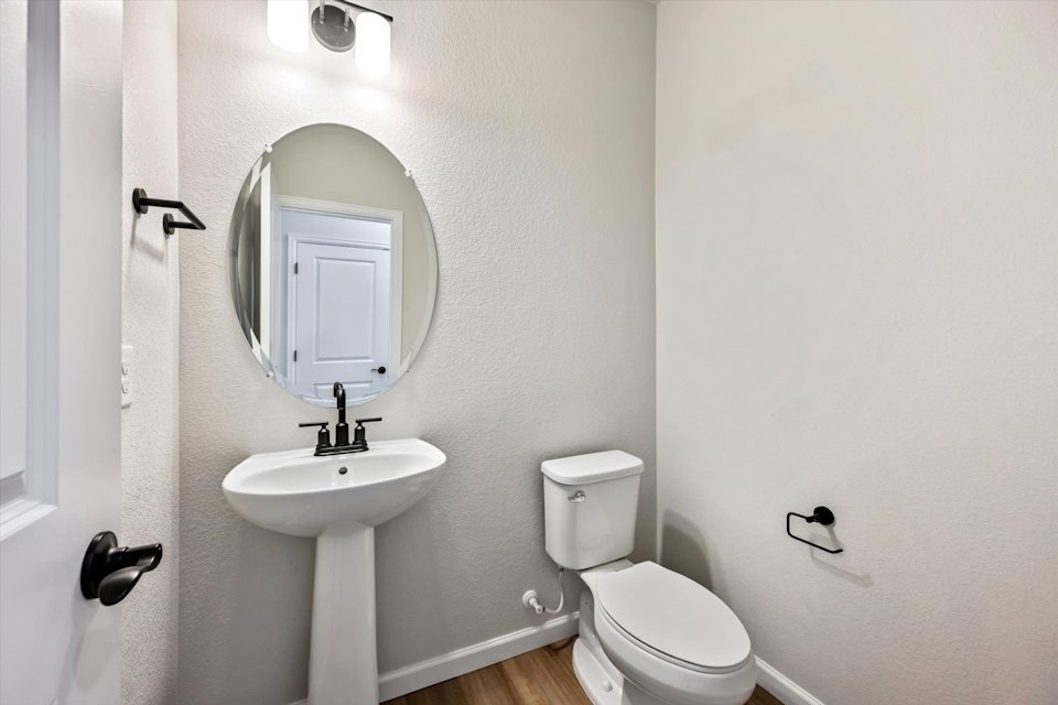 A bathroom with a sink and toilet.
