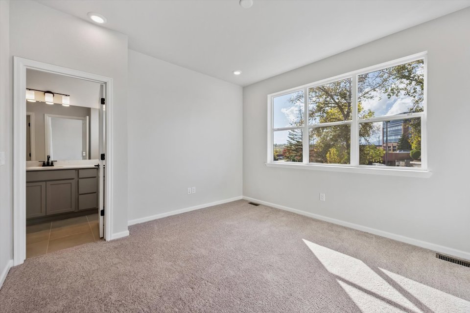 A large empty room with a large window.