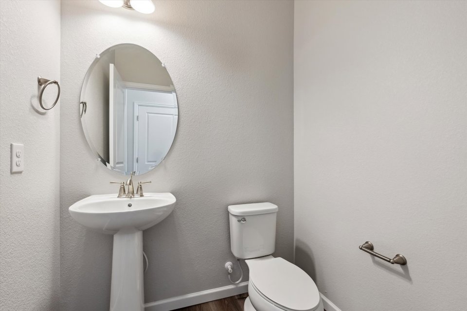 A bathroom with a sink and toilet.