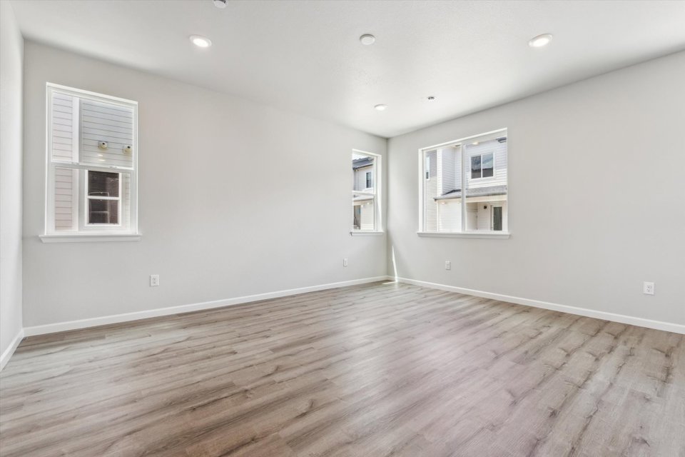 A room with white walls and windows.