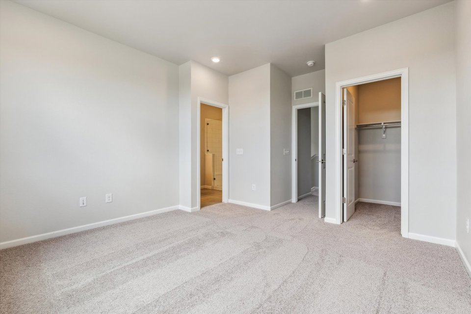 A hallway with white walls.