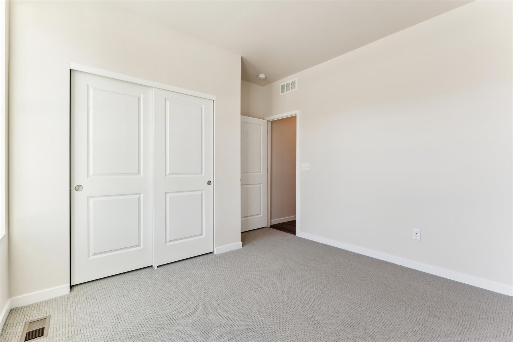 A room with white doors.