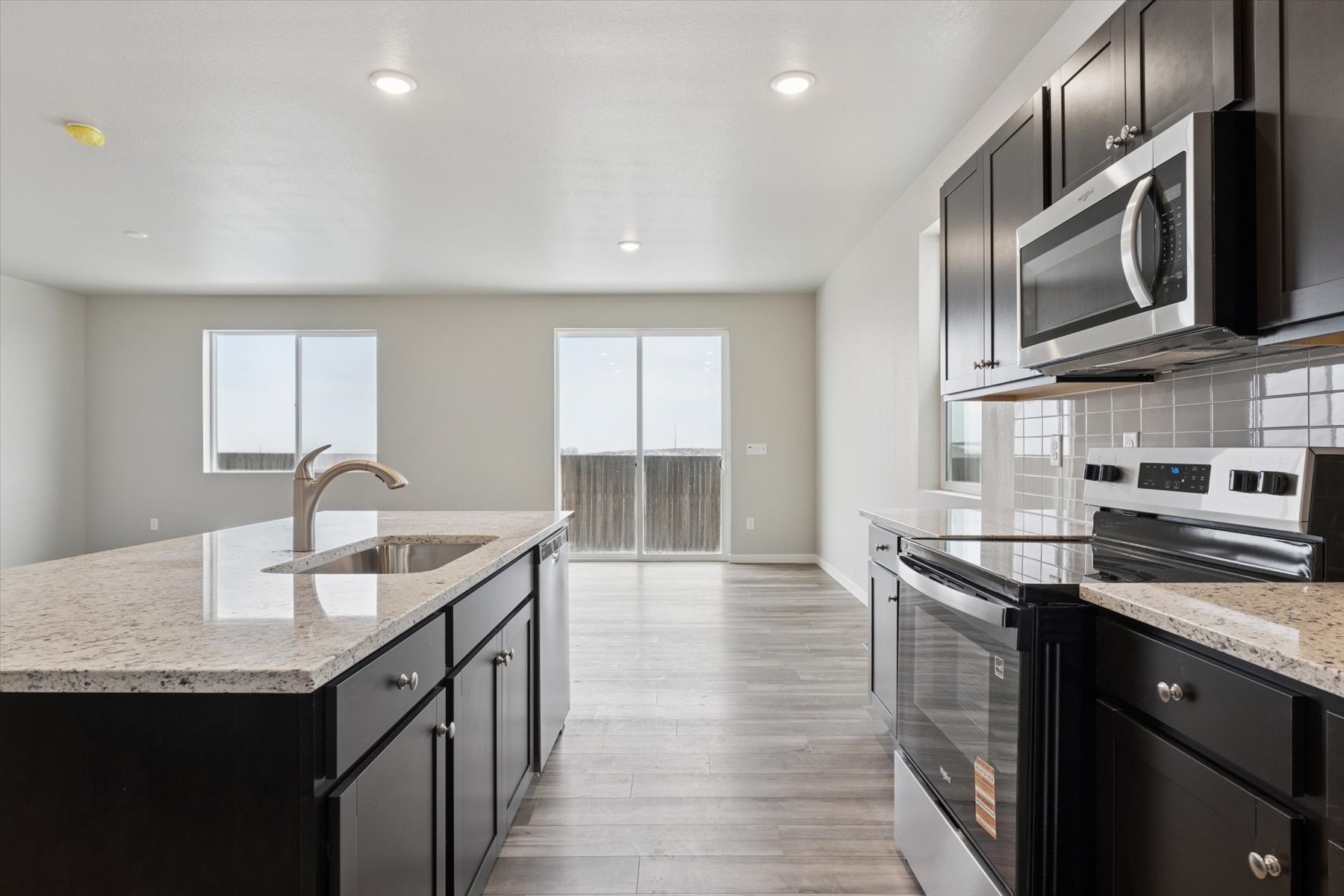A kitchen with black appliances.