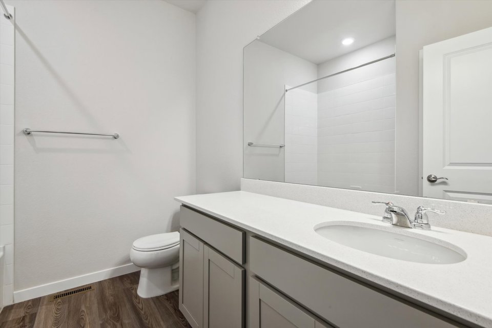 A bathroom with a sink and a toilet.