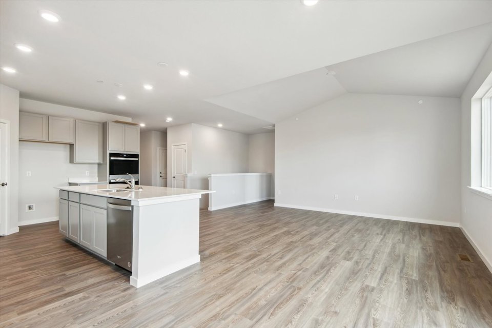 A large kitchen with white cabinets.