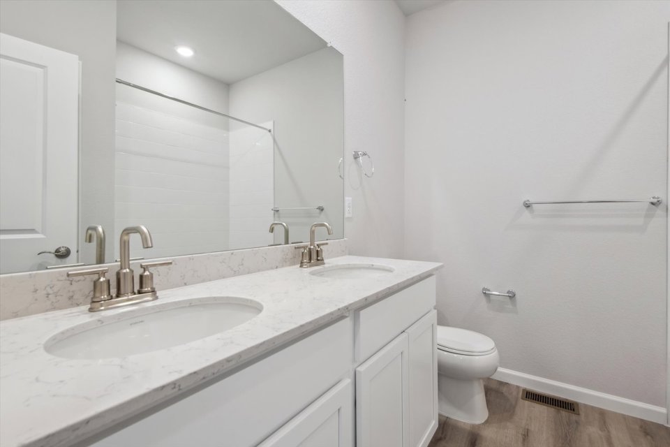 A bathroom with a sink and a toilet.