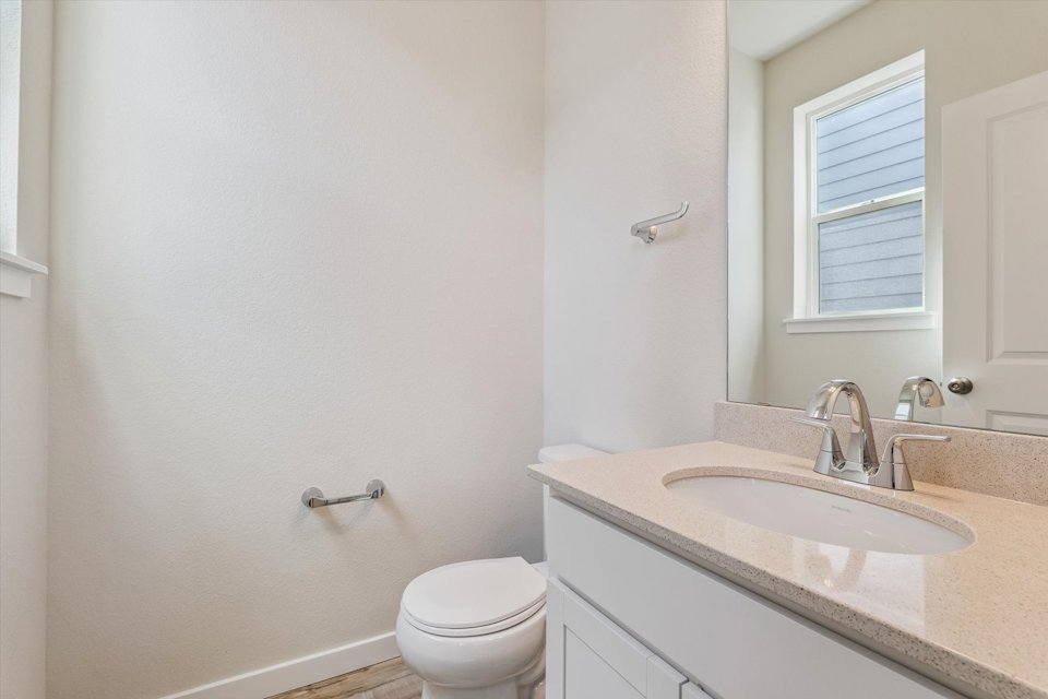 A bathroom with a sink and toilet.