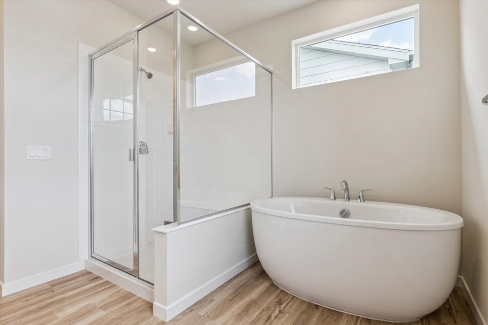 A bathroom with a glass shower.