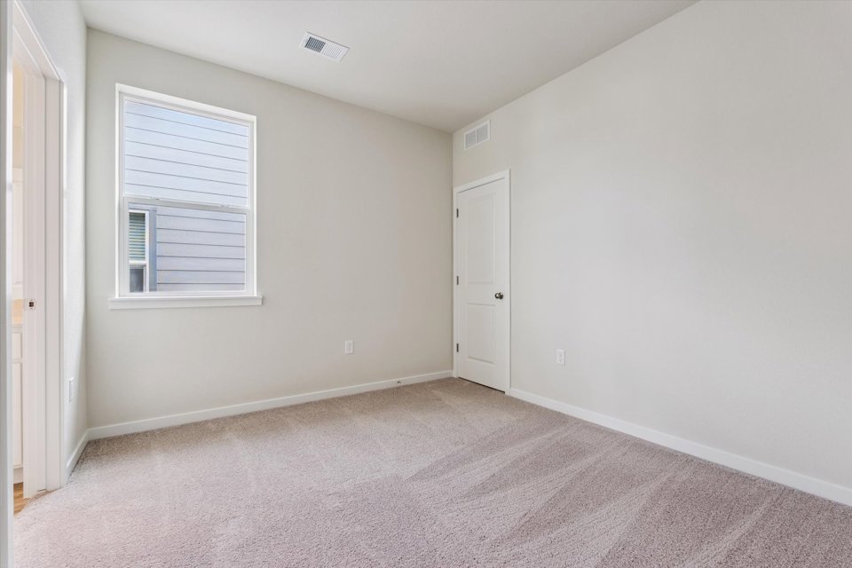 A room with a door and a window.