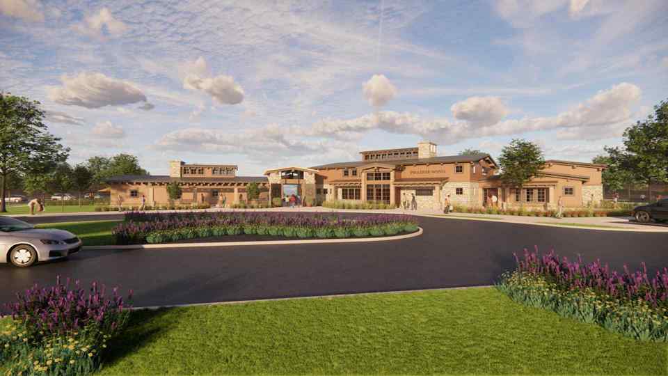 A large building with a parking lot.