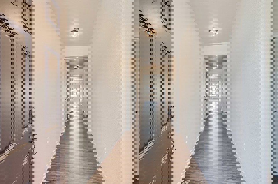 A hallway with white walls.