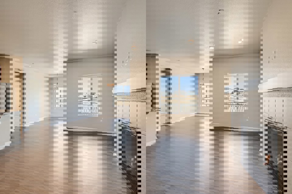 A large kitchen with a large window.