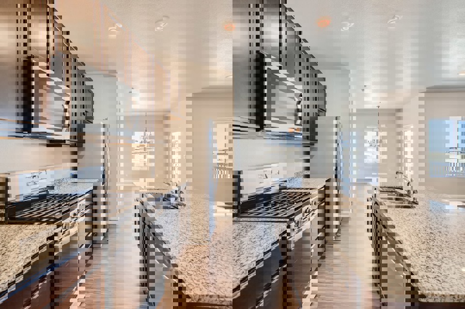 A kitchen with stainless steel appliances.