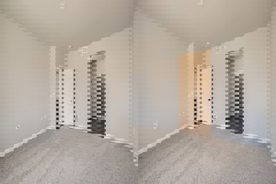 A hallway with white walls.