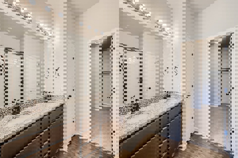 A bathroom with a large marble countertop.