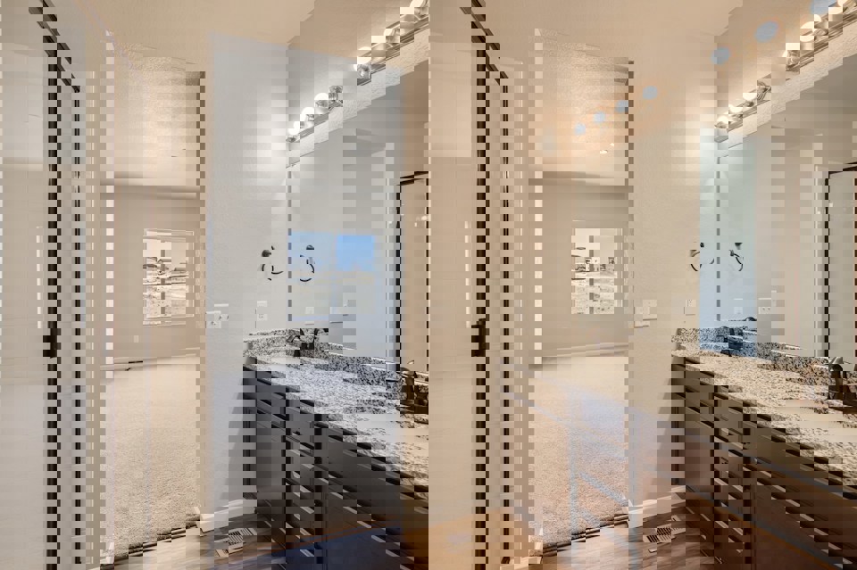 A bathroom with a large shower.