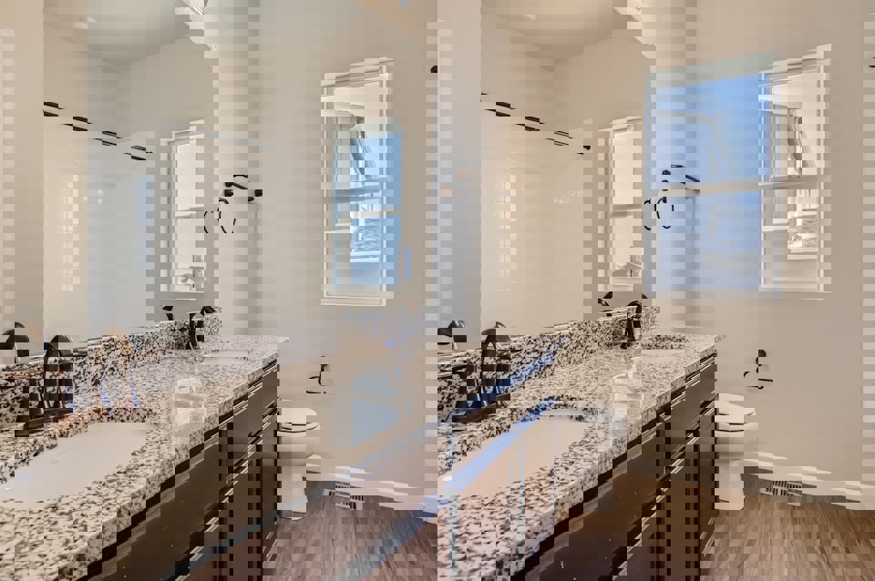 A bathroom with a marble countertop.