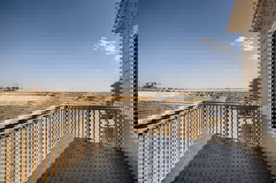 A deck overlooking a beach.