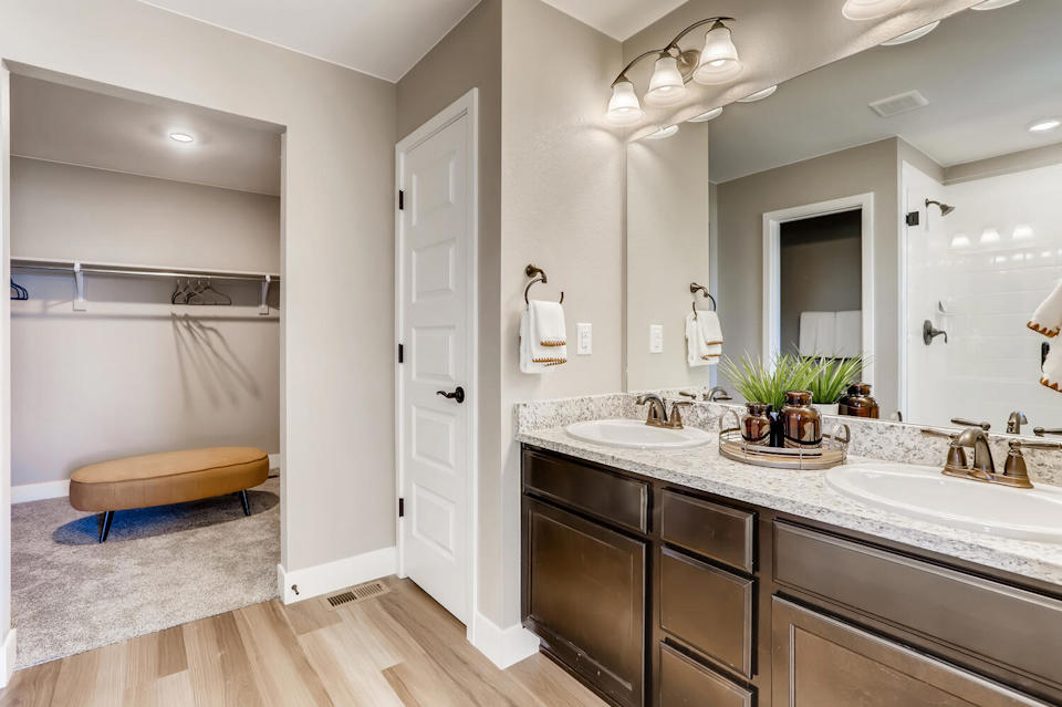 A bathroom with a large mirror.