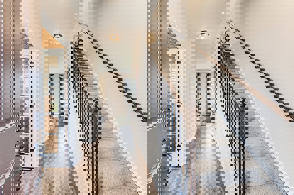 A long hallway with a wood railing.