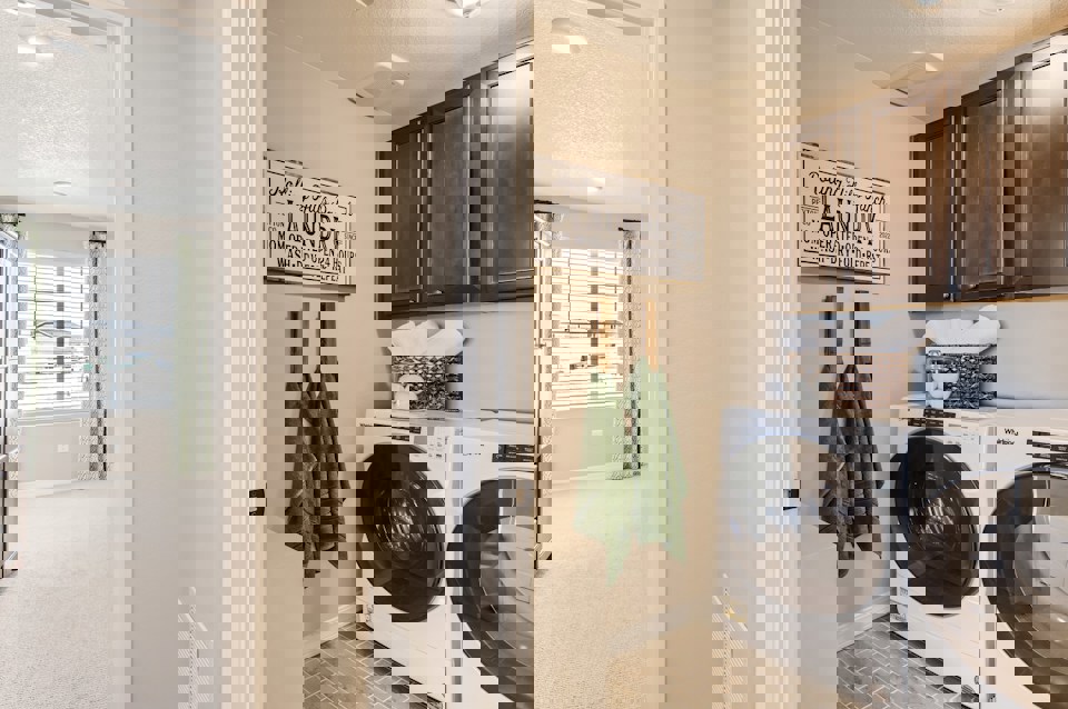 A laundry room with a washer and dryer.