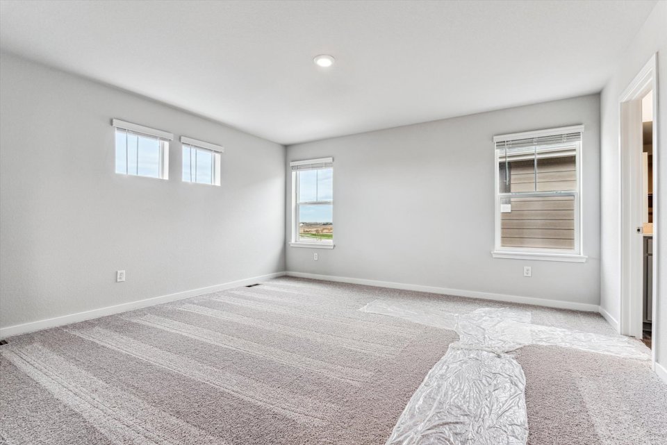 A room with a bed and a window.