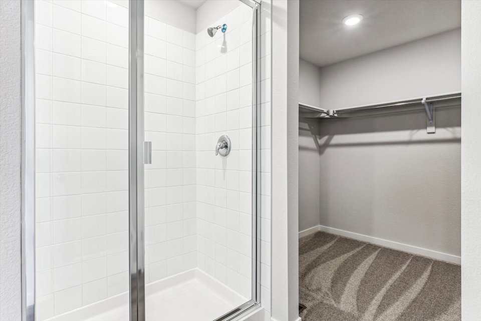 A bathroom with a shower unit.
