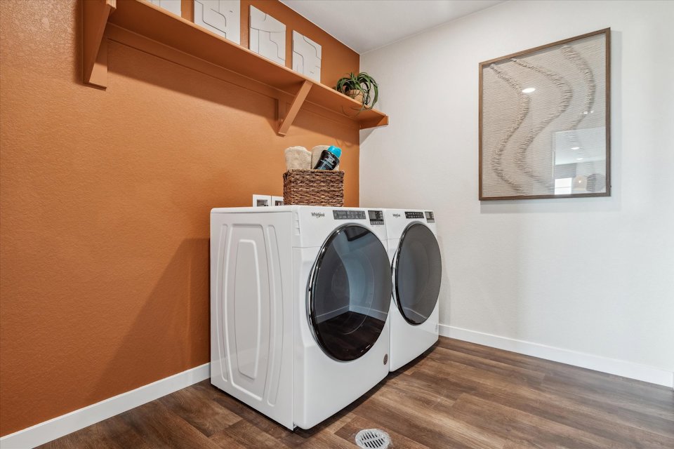 A laundry room with a washer and dryer.