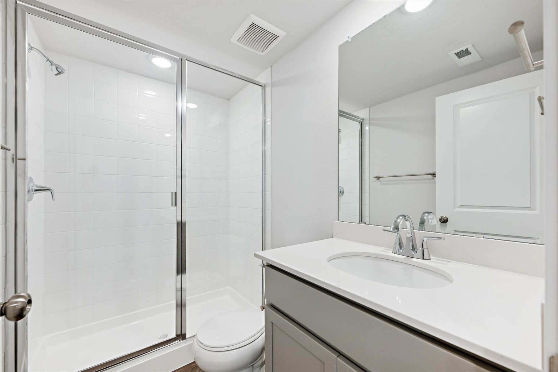 A bathroom with a glass shower.