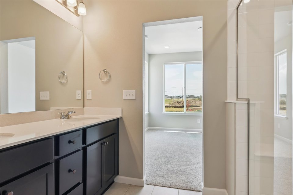 A bathroom with a glass door.
