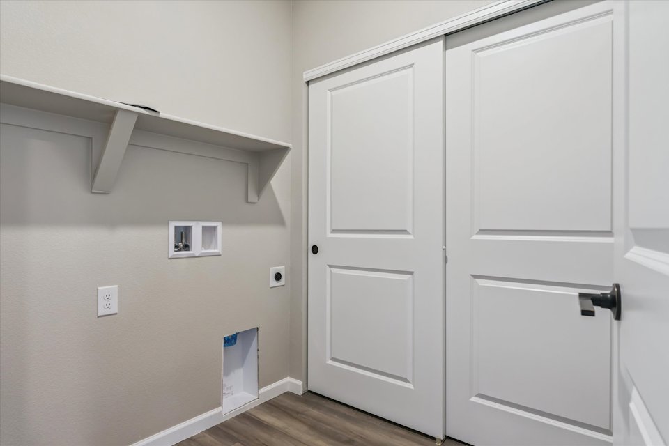 A white wall with white doors.