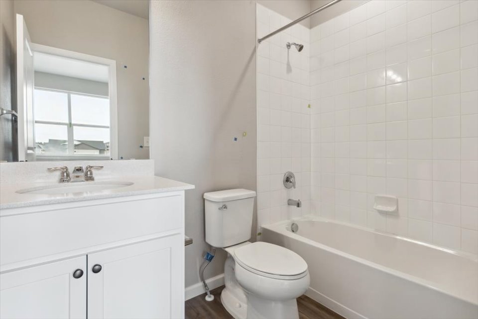 A bathroom with a toilet and sink.