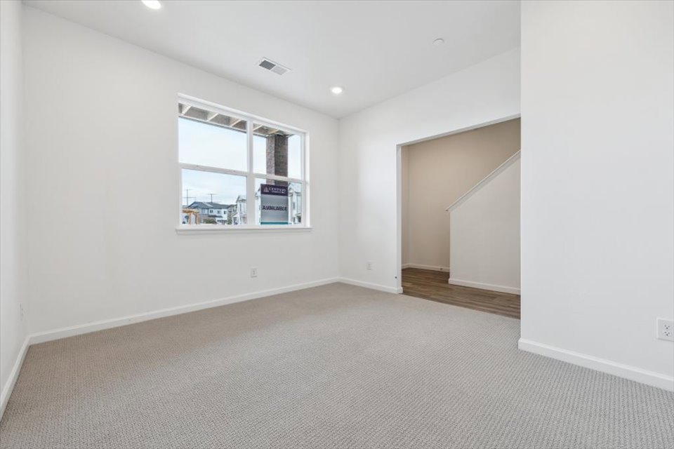 A room with a window and a door.